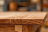 Warm-toned workshop photography showcasing handcrafted wooden furniture pieces